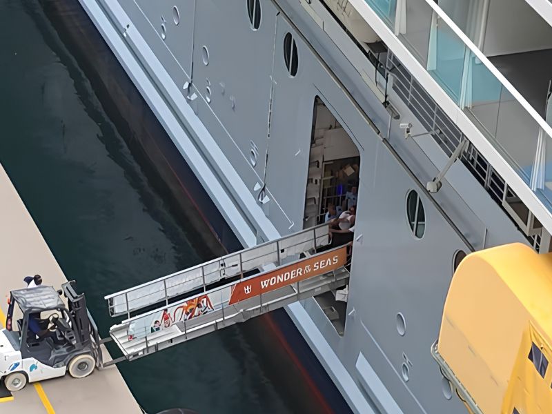 Wonder of the Seas gangway fall step 1 as it's being lifted