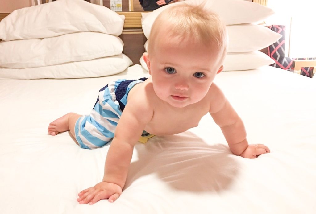 Baby Adam on the bed