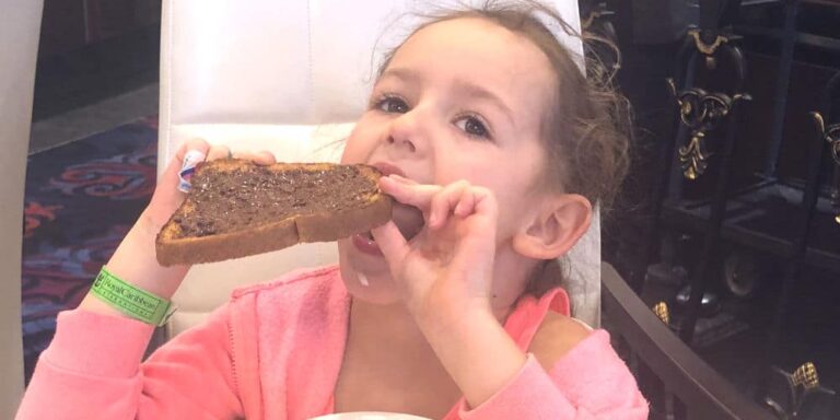 Leonie with chocolate spread in the mai9n dining room on Mariner of the Seas