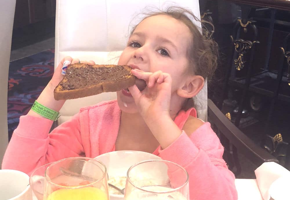 Leonie with chocolate spread in the mai9n dining room on Mariner of the Seas