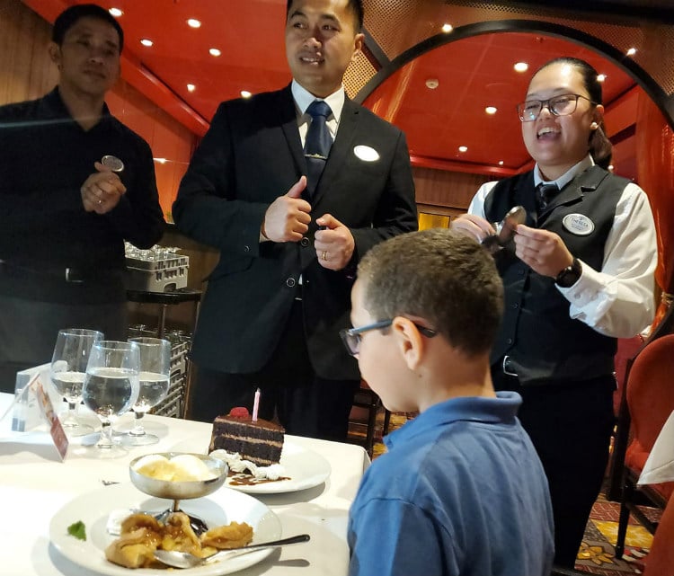 birthday boy with singing waiters