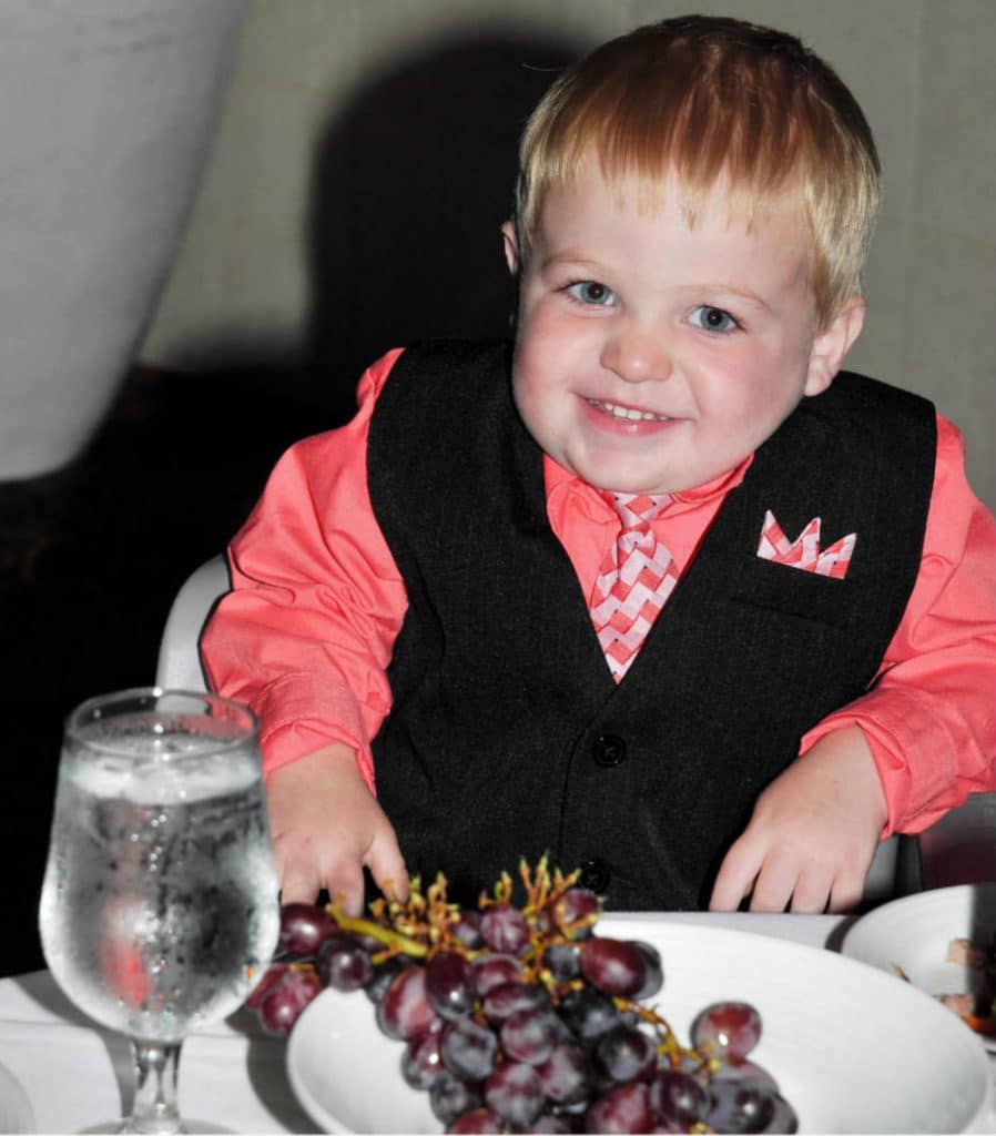 boy with grapes in main dining room on Royal Caribbean cruise