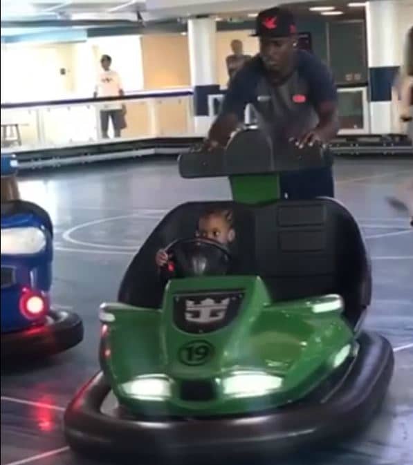 girl being pushed in bumper cars