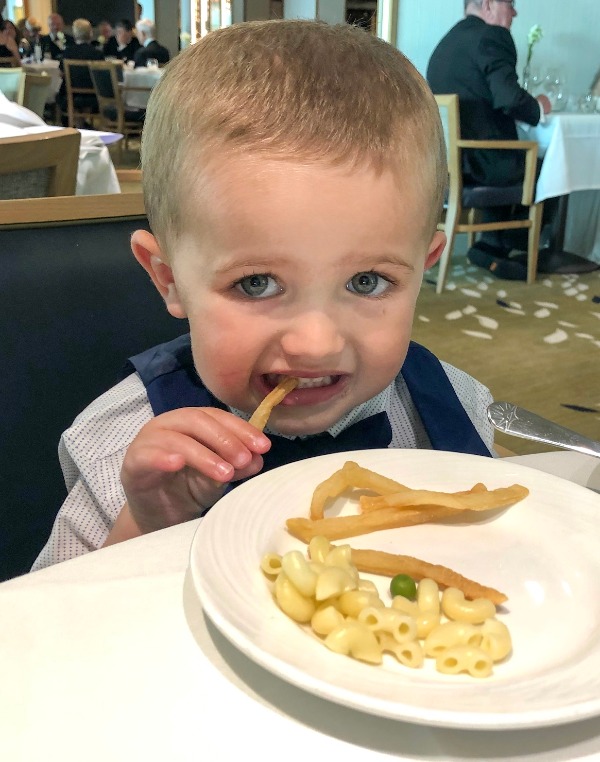 Adam eating food on a cruise