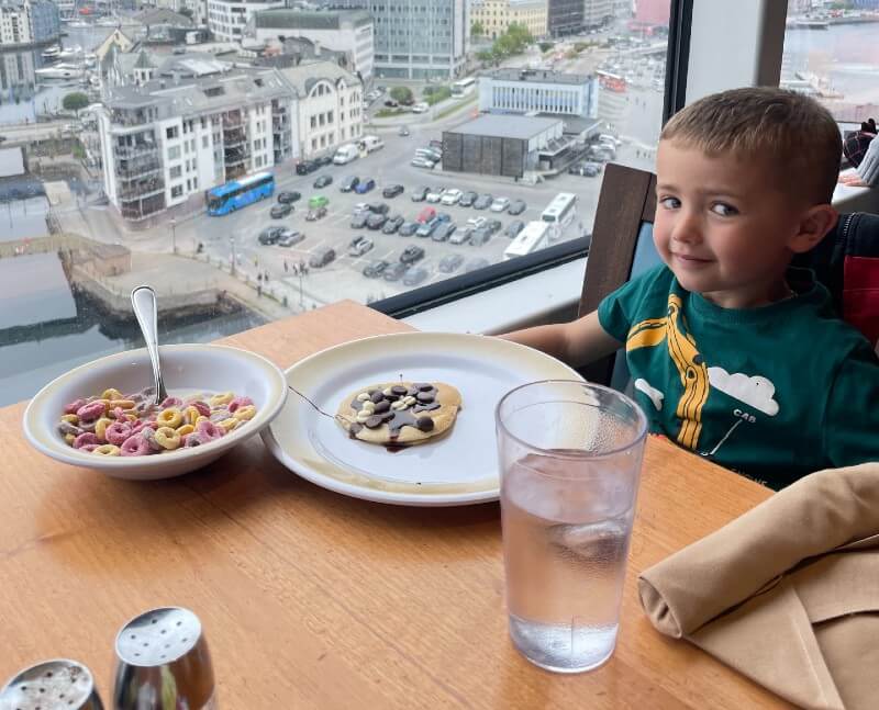 Boy with glass of water on Royal Caribbean cruise