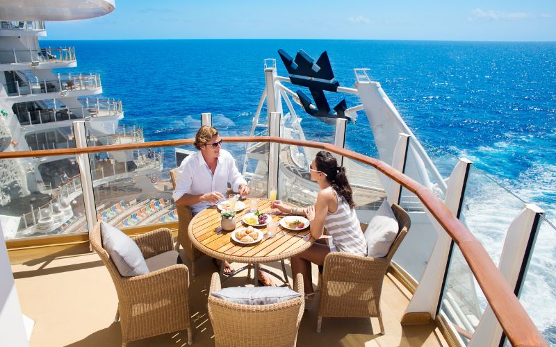 couple dining in the balcony of a cruise ship