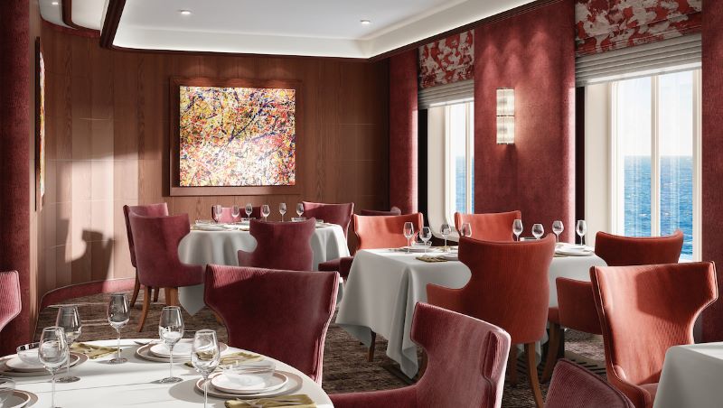 Inside the Atlantide restaurant on a Silversea cruise ship, featuring elegant velvet rose chairs, crisp white tablecloths, sophisticated wood paneling, and a vibrant abstract painting, all with an ocean view from the large windows.