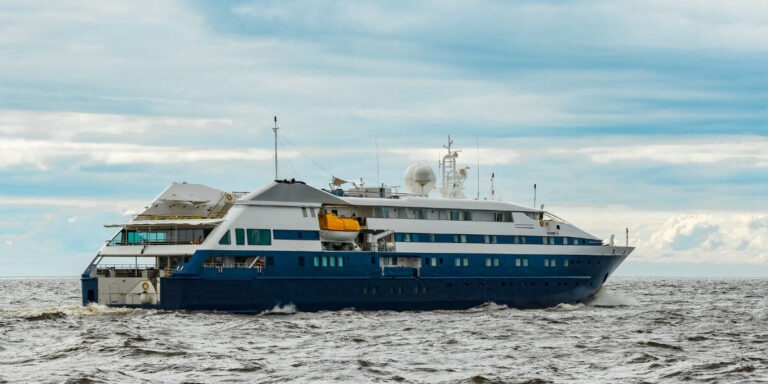 Blue small cruise ship