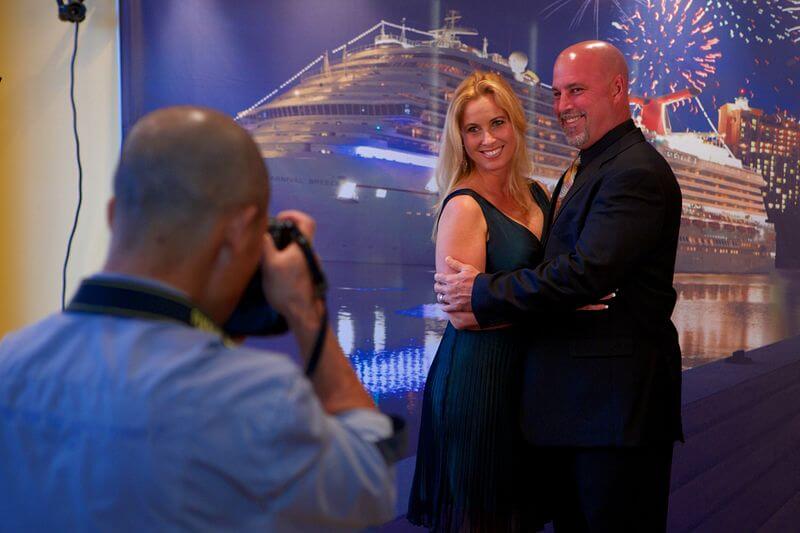 Couple having their photo taken on formal night on a Carnival cruise