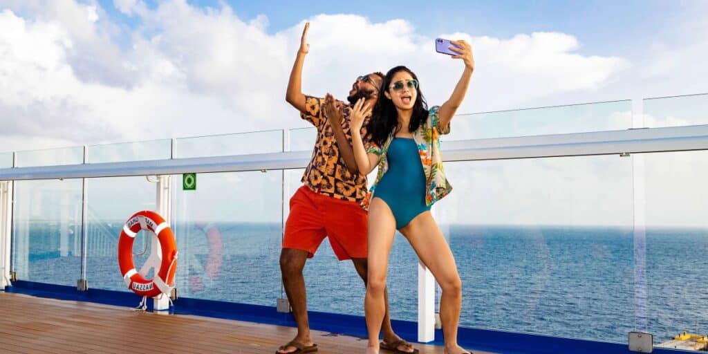 Carnival Couple Using Phone