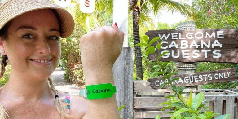 Woman showing her green cabana wristband