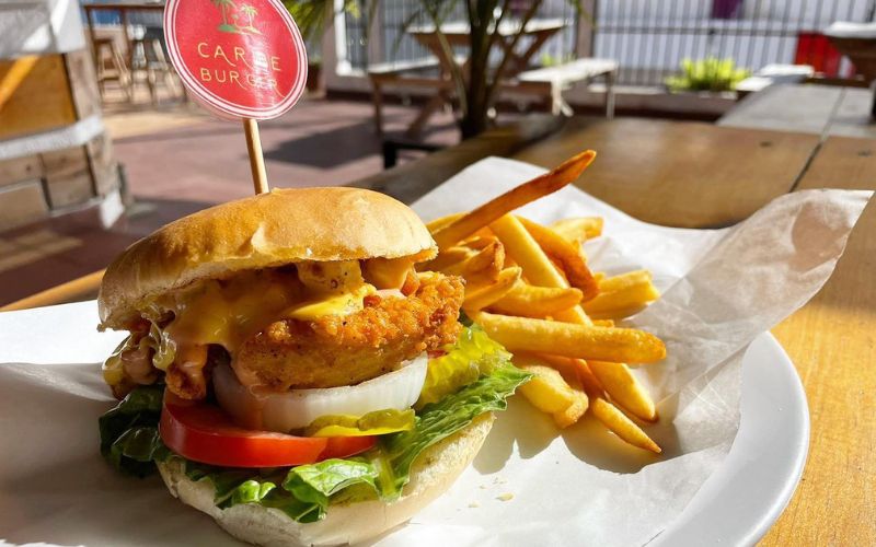 a serving of burger and fries at Caribe Burger & Grill