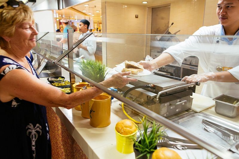 crew member working in the buffet