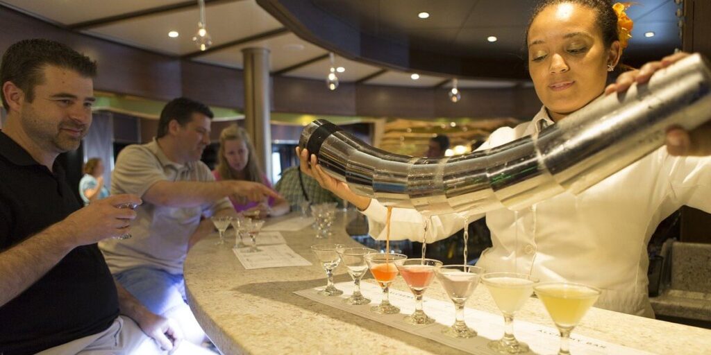 Bartender pouring cocktails on a Carnival cruise