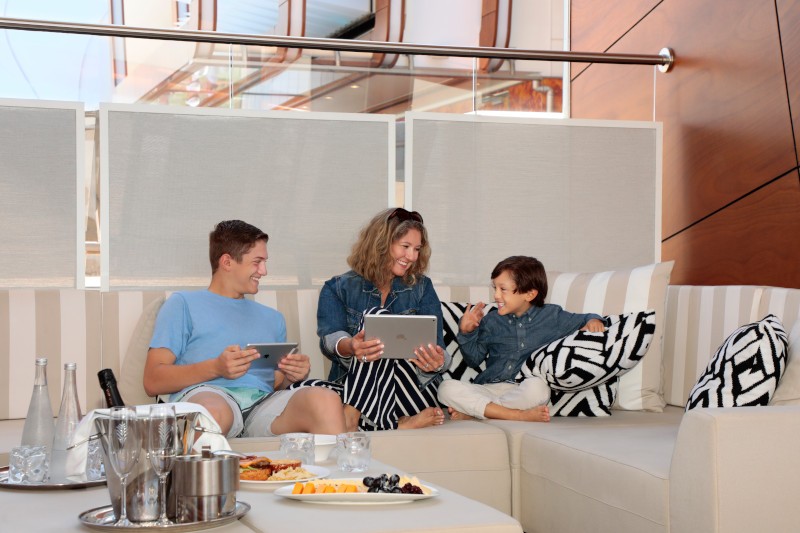 People enjoying the wifi on a Celebrity cruise