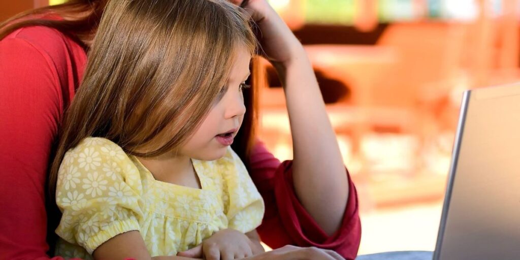 Child and parent booking a cruise