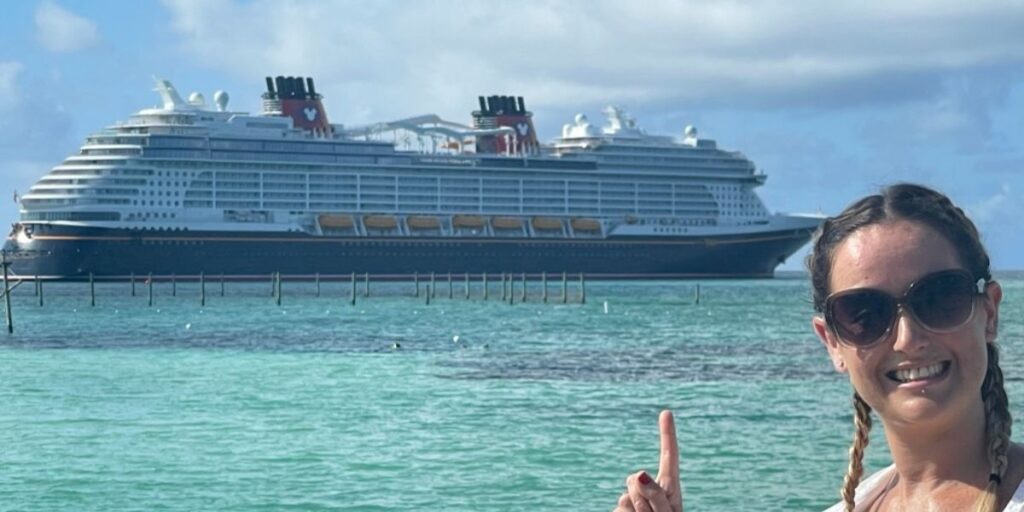 Jenni from Cruise Mummy in front of a cruise ship solo.