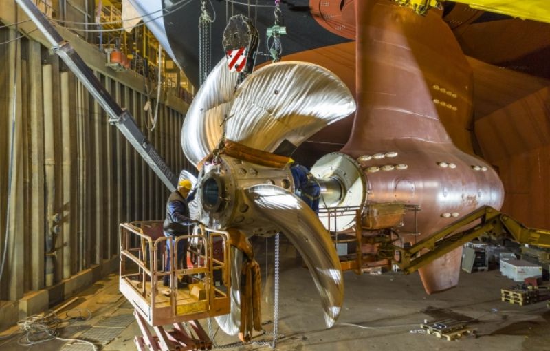 The 20.5-megawatt azipod is installed onto Spectrum of the Seas