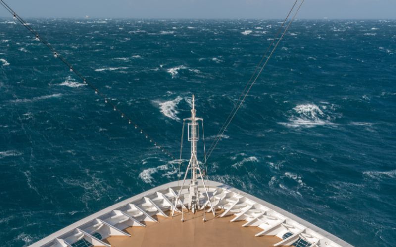 Cruise ship traveling through rough seas