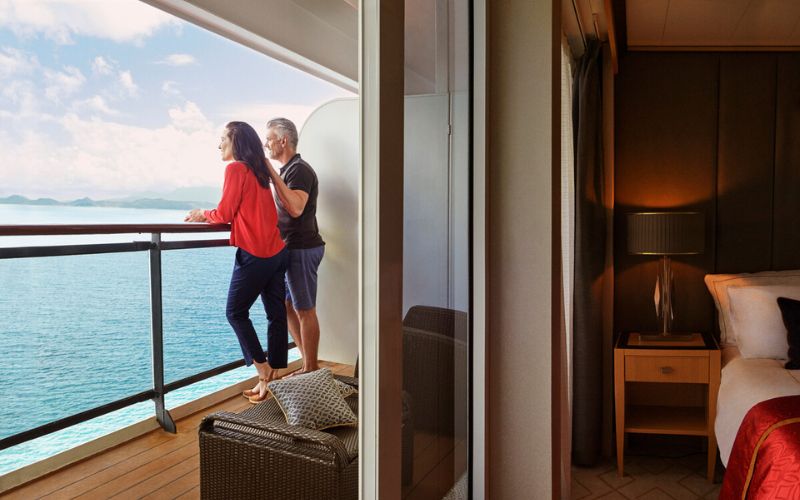 Couple admiring the ocean view from the balcony