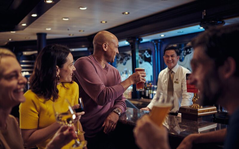 Cunard guests drinking at Golden Lion Pub