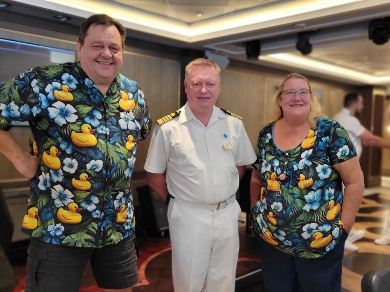 Cruising Quackers Kelly and Dave with a ship officer