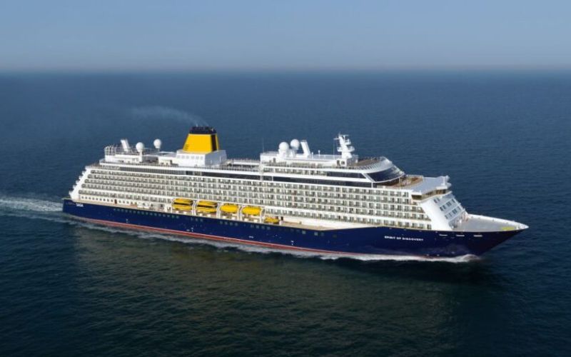 A large cruise ship, Saga Spirit of Discovery, sailing in the ocean.