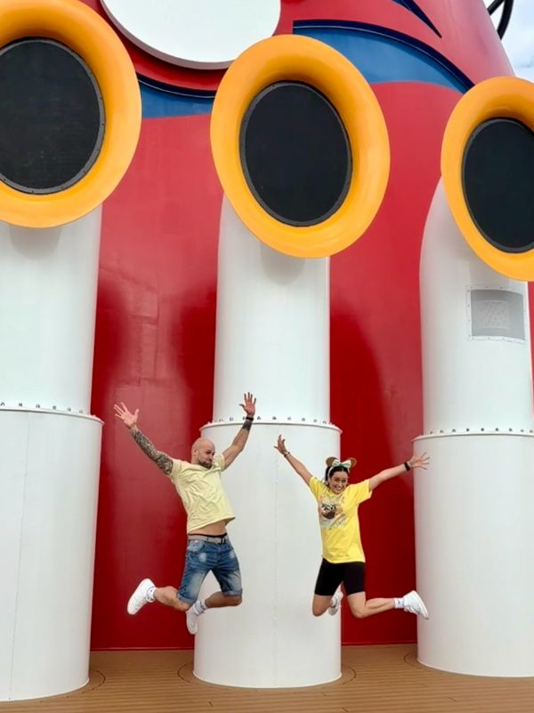 My husband and I at the funnel on the Disney Wish