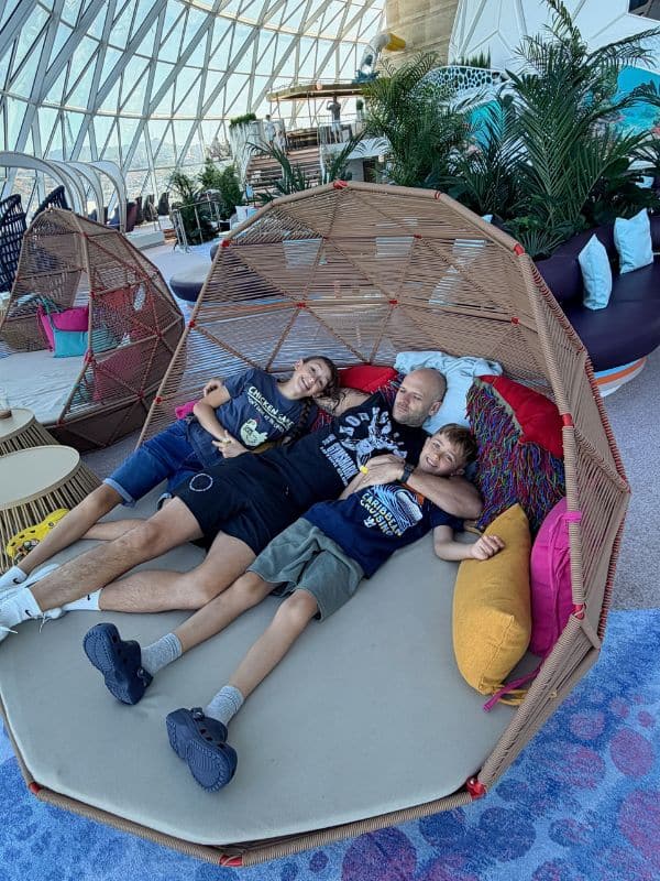 Family relaxing in AquaDome on Legend of the Seas