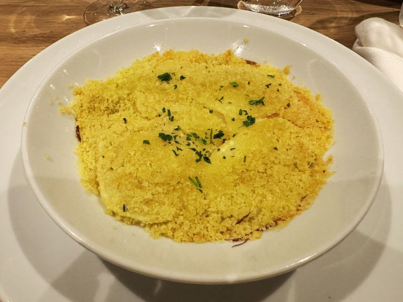 A plate of couscous garnished with parsley, exemplifying the variety of international cuisine available in the main dining room on the Costa cruise ship.