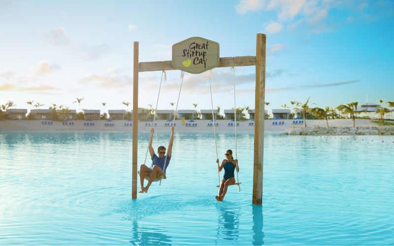 Couple having fun at Great Stirrup Cay swings