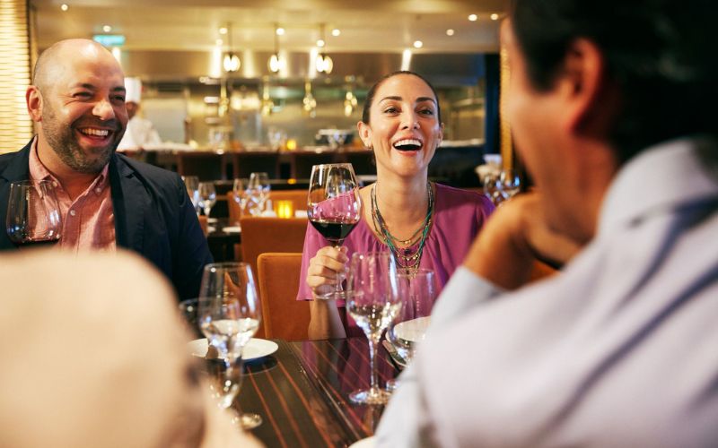 Guest drinking wine on Carnival cruise