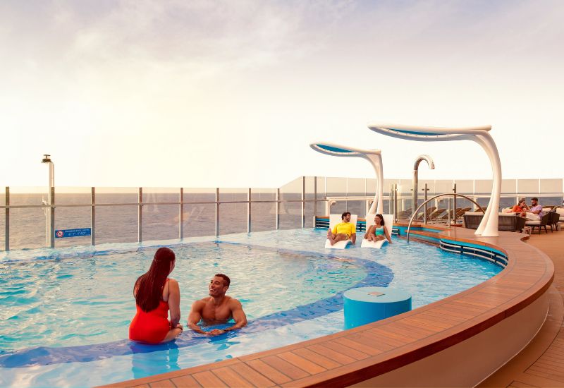 Guests on Mardi Gras summer landing pool