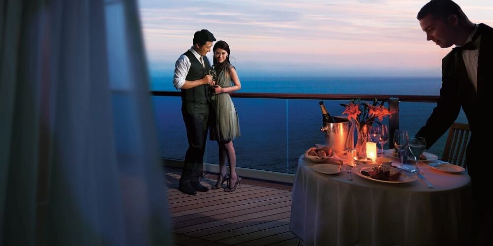 Couple onboard a cruise ship with romantic evening meal