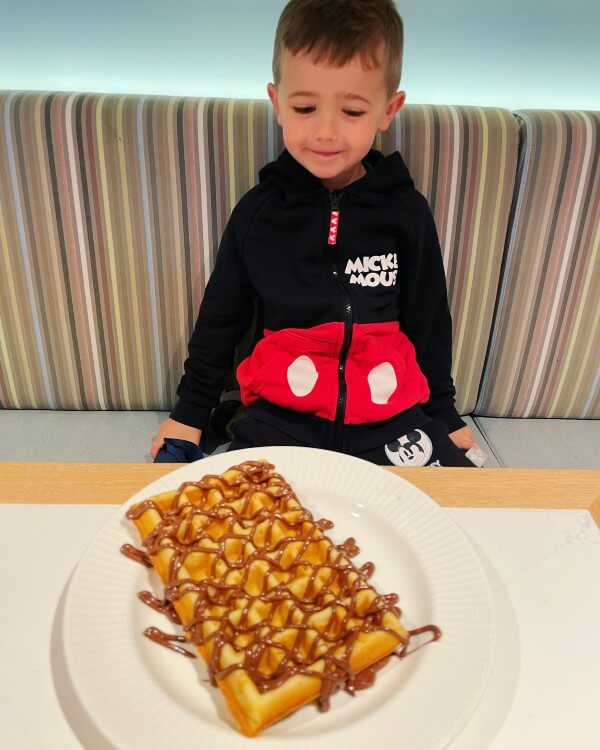Adam with waffles in buffet restaurant