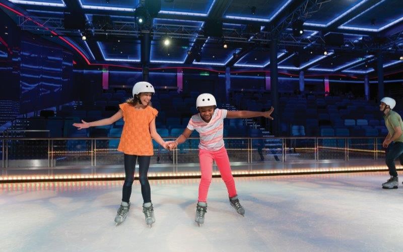 Kids enjoying at the ice skating rink onboard Harmony of the Seas