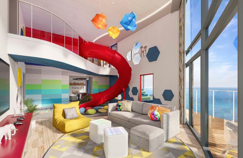 The vibrant and playful Ultimate Family Townhouse on Royal Caribbean's Icon of the Seas, featuring a two-level suite with a slide, modern living area, colorful decorations, and large windows offering a panoramic ocean view.