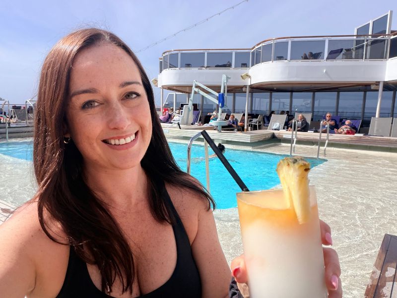 Jenni enjoying a cocktail on the pool deck
