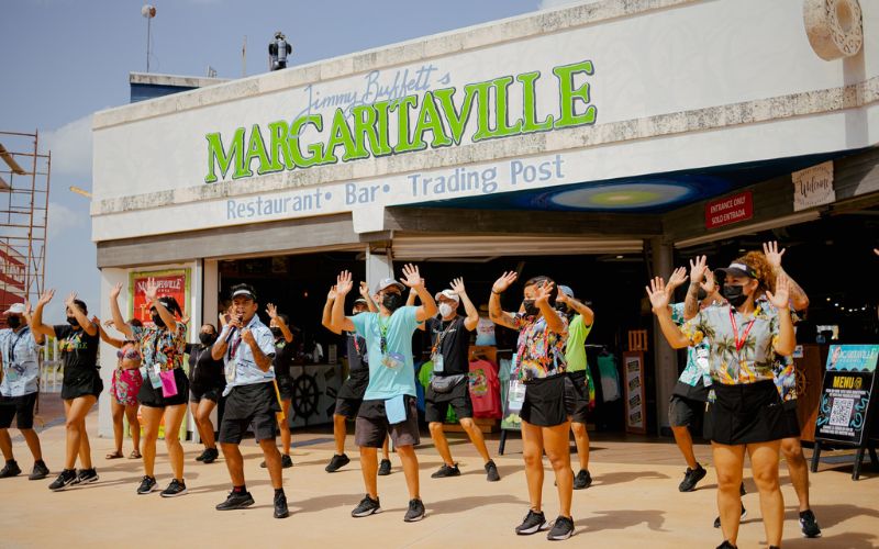 Staff dancing outside Jimmy Buffett’s Margaritaville restaurant 