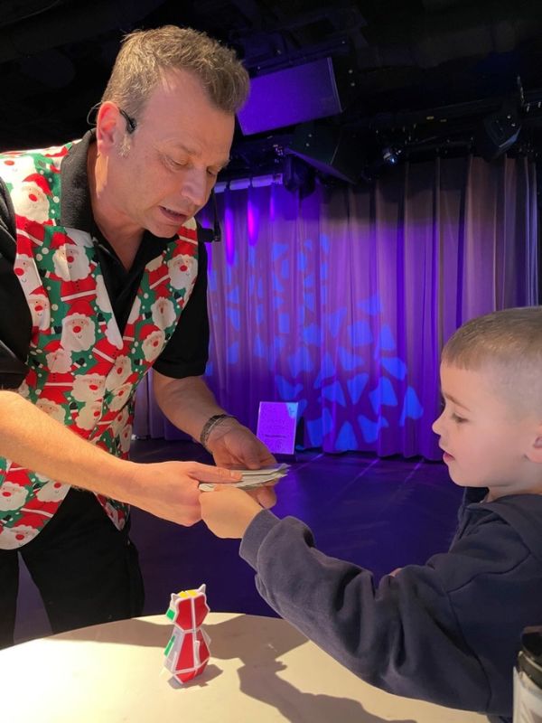 My son enjoying the magic show on Christmas morning