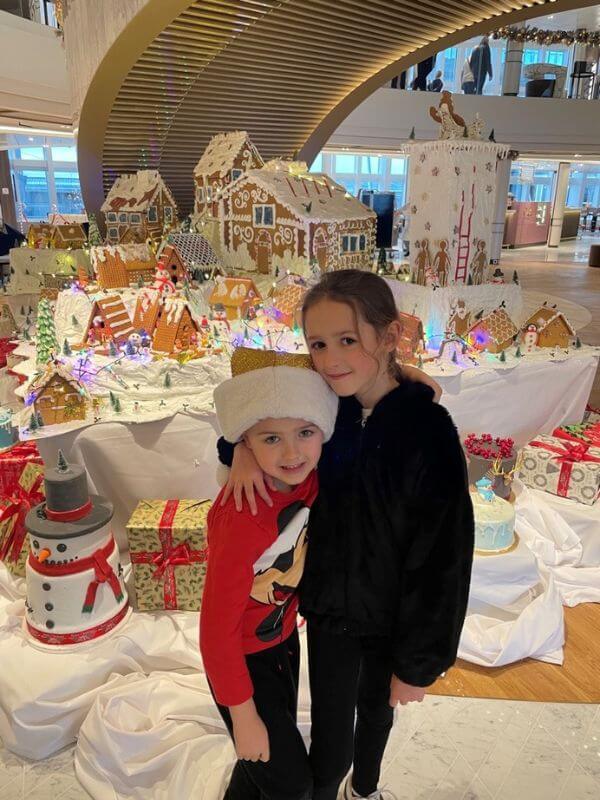 Kids Spending Christmas on a Cruise with gingerbread houses