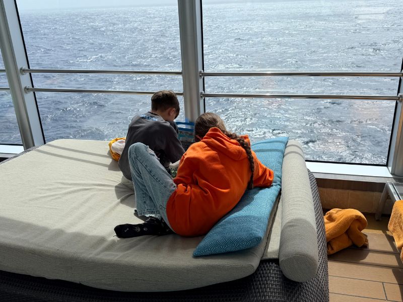 Kids on day bed watching the view