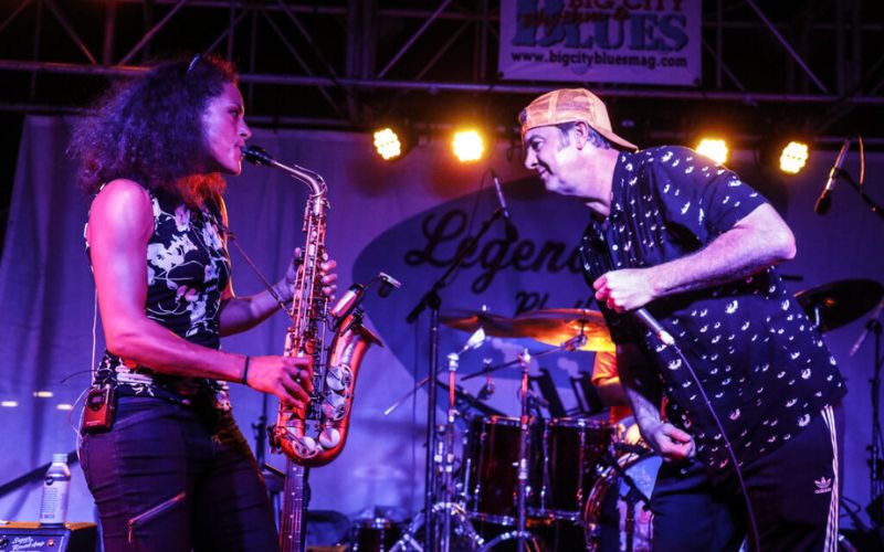 woman and a man performing on stage