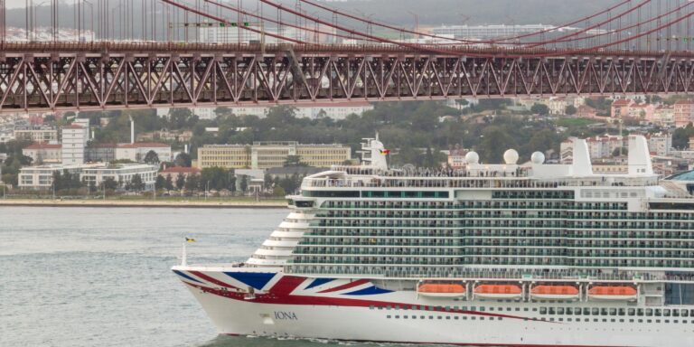 Iona from P&O passing under a bridge at Lisbon