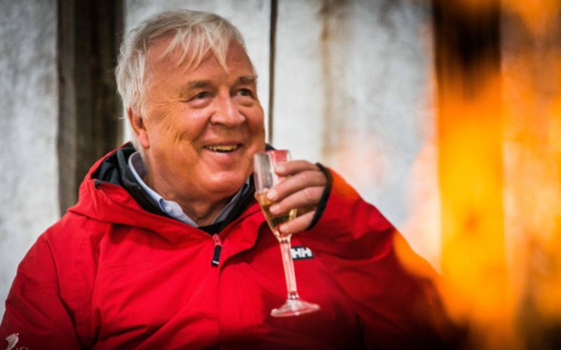 Torstein Hagen smiling and holding a glass of champagne