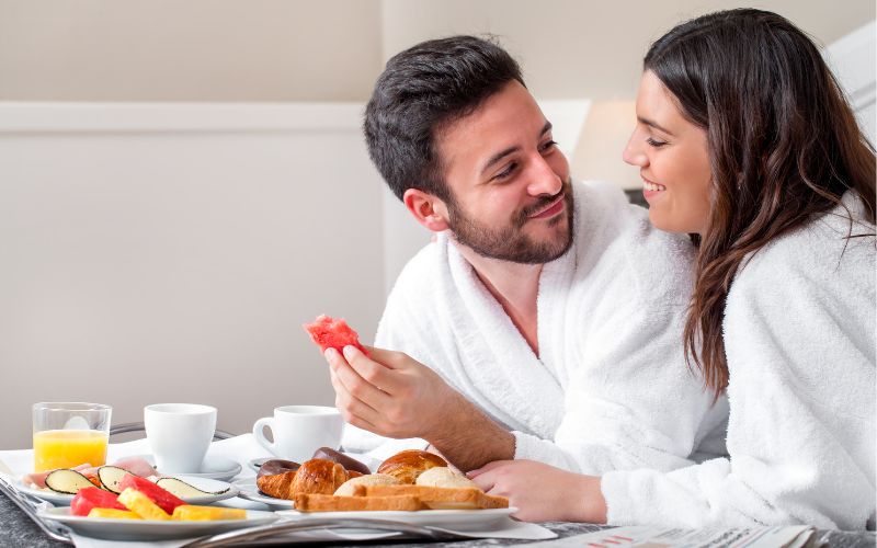 A couple enjoying the fantastic food from room service