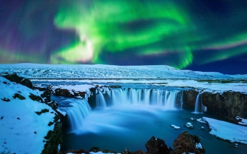 The Northern Lights over the Godafoss Waterfall