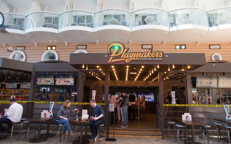 In front of Playmakers Sports Bar & Arcade