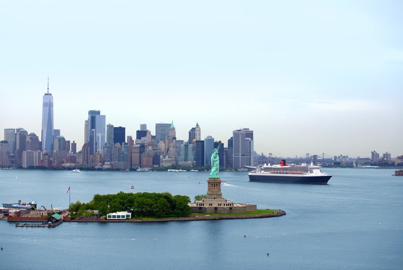 Port of New York showing a cruise ship and the Statue of Liberty