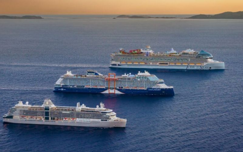 Three Royal Caribbean cruise ship lined side by side during the sunset